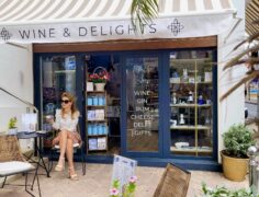 Woman sitting in front of the Le Dutch store in Philipsburg, St Maarten