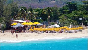 Bar and umbrellas on Karakter beach, next to the airport of St Maarten