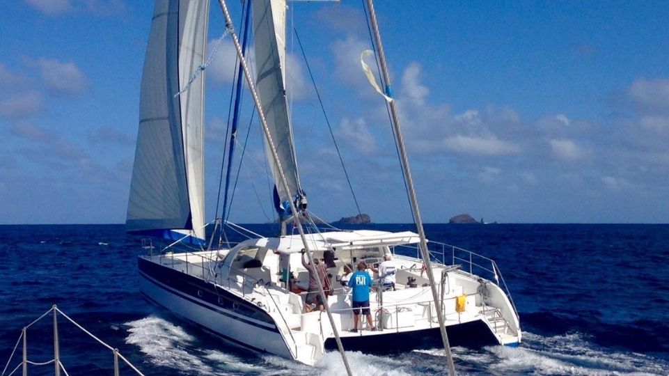 Sailing Catamaran riding the waves near SXM