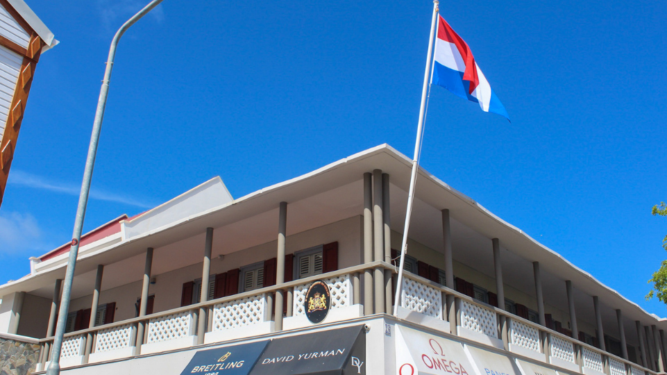 The formerly catholic convent, now Permanente Vertegenwoordiging Philipsburg (VNP) with Dutch Flag waving