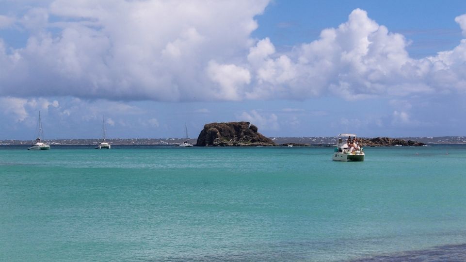 Catamarans near St Martin’s Creole Rock snorkeling spot