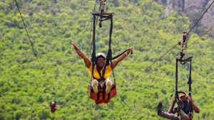 Tourists are enjoying the views and landscape while being on the St Maarten flying dutchman which is the steepest zipline in the world