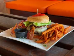 A burger with fries in Dutch Blond Beach Bar in Phillipsburg