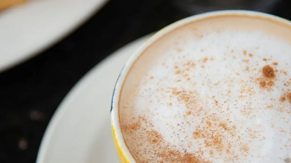 a cup of coffee with cream at Fort Amsterdam
