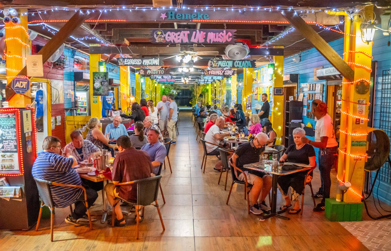 One of the Dutch side St Maarten Simpson Bay restaurants Pineapple Pete hosting room full of visitors eating and drinking
