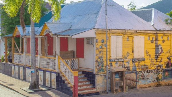Historical yellow wooden building of Escargot restaurant