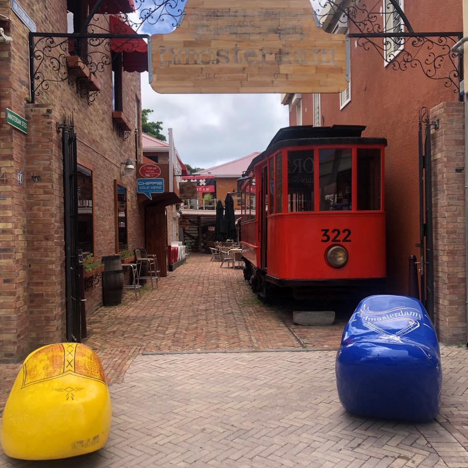 Amasterdam Bar entrance in Frontstreet, Philipsburg with a red tram and two Dutch klompjes