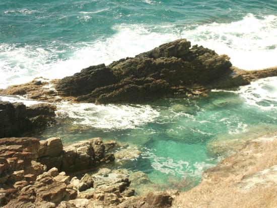 Guana Bay Beach rocks and water during a windy day on the island of St Maarten / St Martin