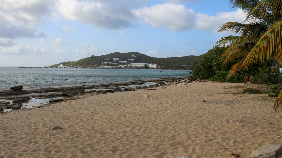 Galisbay Beach on the French side of the island of St Maarten / St Martin with hills on the back of the picture