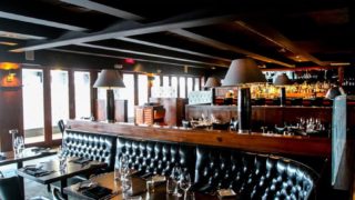 Jax Steakhouse & Cocktail Bar has a cozy atmosphere with many tables and seating areas for tourists to visit on St Maarten / St Martin