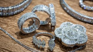 diamond rings and earrings on the table at Ocean Jewelers