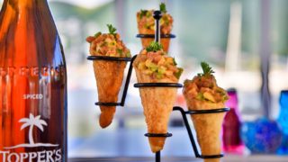 Located in Simpson Bay St Maarten, Topper's Restaurant & Bar display their rum and food cones on the counter