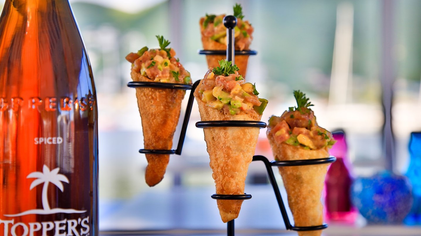 Located in Simpson Bay St Maarten, Topper's Restaurant & Bar display their rum and food cones on the counter