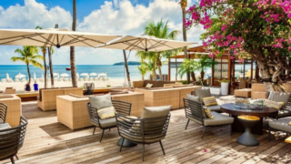 Terrace in the sun with bougainvilleas and view of boardwalk Philipsburg and Fort Amsterdam, St Maarten