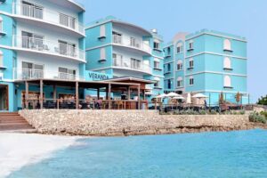 Three buildings of Veranda Market and Bistro close to the beach and sea on St Maarten / St Martin
