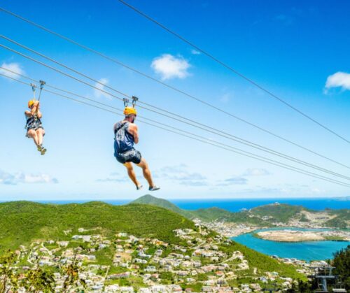 Two persons ziplining in the Rainforest Adventure Park
