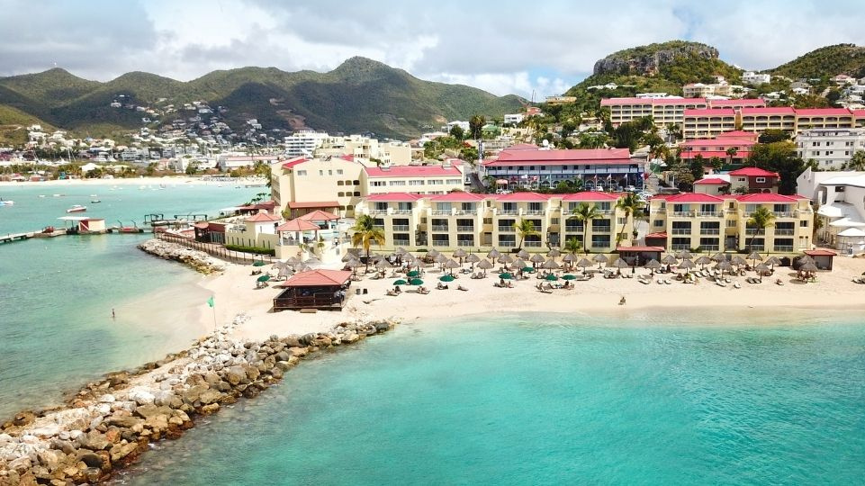 Beach side view of Simpson Bay, marina, Simpson Bay Lagoon, catamarans and the resorts seaview rooms