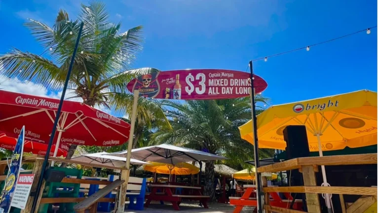 In front of a sign by restaurant Buccaneer in Simpson Bay