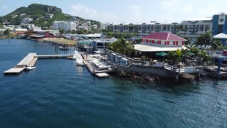 The Sint Maarten Yacht Club from a side perspective where you can see the Club and a little bit of the surrounding Simpson Bay area