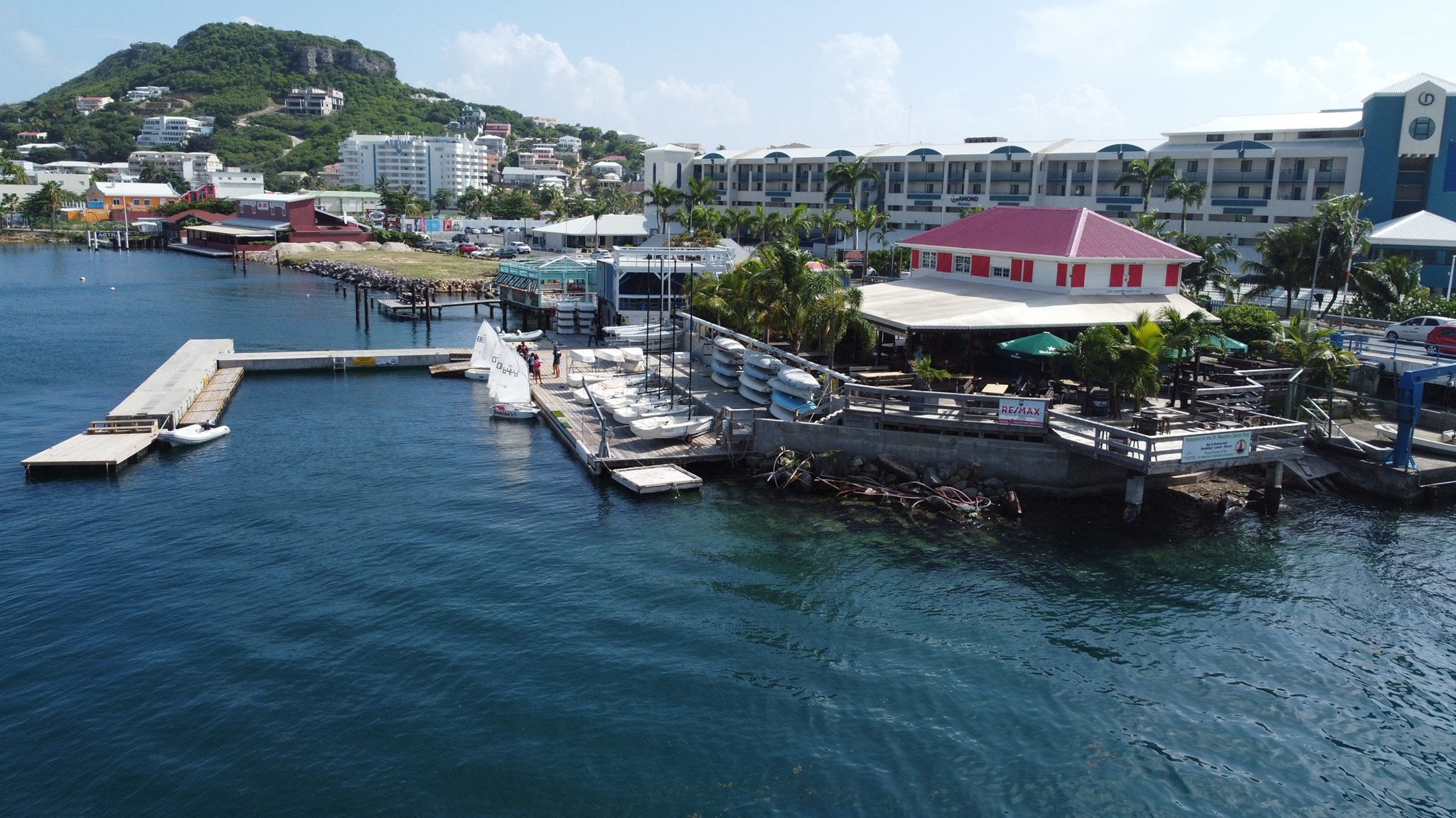 The Sint Maarten Yacht Club from a side perspective where you can see the Club and a little bit of the surrounding Simpson Bay area