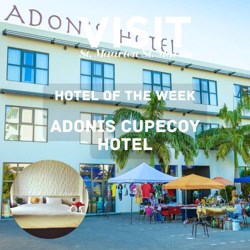 Adonis Cupecoy Hotel with colourful market stands in front of the building