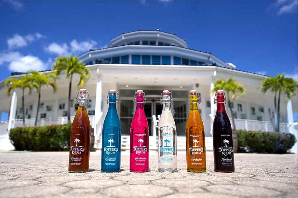 The different colorful bottles of flavors of the local made Topper's Rhum SXM