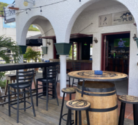 Huppel The Pub SXM view of the outside tables and chairs