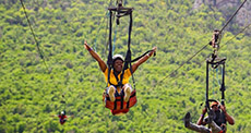 Girl coming down the Soualiga Sky Explorer and Flying Dutchman zipline 