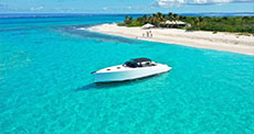 Luxury boat charter moored at Orient Bay Beach 