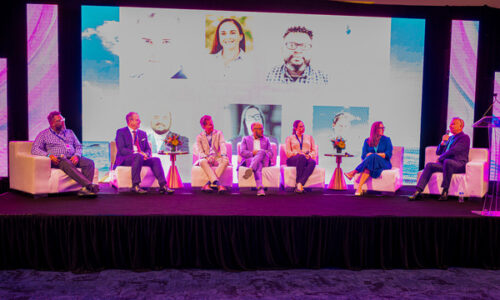 people from neighboring islands at Sonesta Maho Beach Resort sitting on a podium
