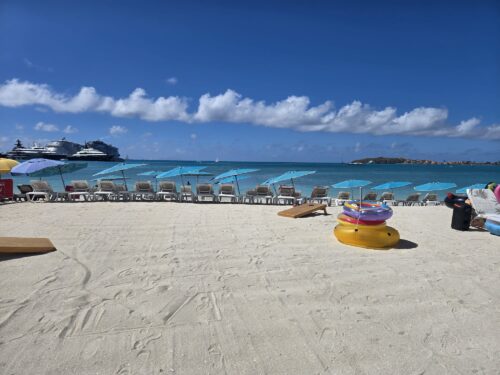 beach with beach chairs that is made photo of the week