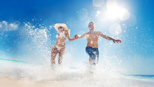 2 people running happy in the sea