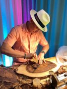 Master roller displaying how to roll your own cigar