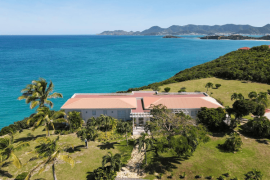 Villa view with steep cliffs St. Maarten coastline in the back
