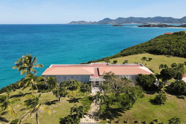 Villa view with steep cliffs St. Maarten coastline in the back