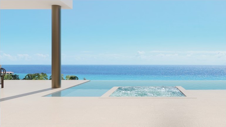 Poolside view of the beach at Infinity Villas by Ellie Saab