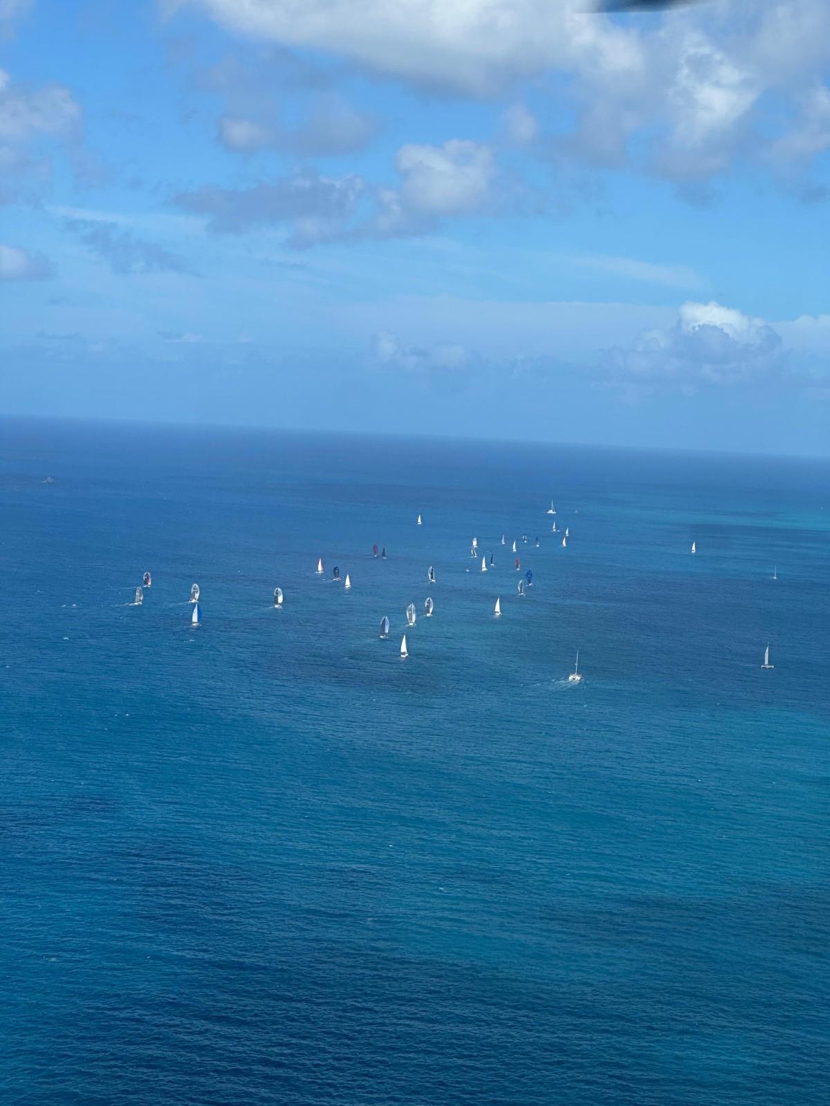 Helicopter view of boats sailing in the st maarten Heineken Regatta 2026