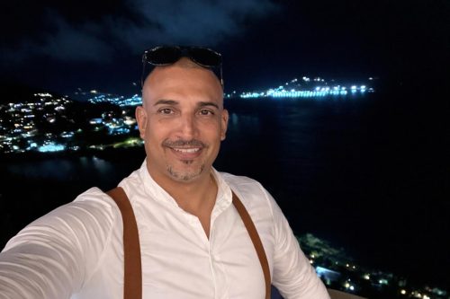 Jesse Peterson from Port de Plaisance Marina with a cruise ship in the background at night