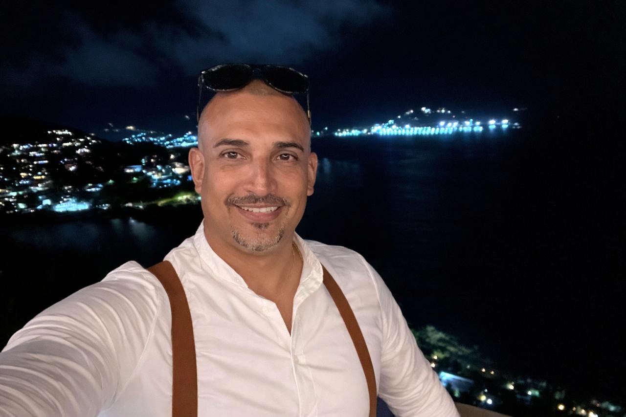 Jesse Peterson from Port de Plaisance Marina with a cruise ship in the background at night