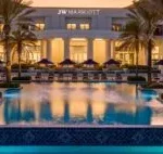 JW Marriot Resort from the front with swimmingpool and palm trees