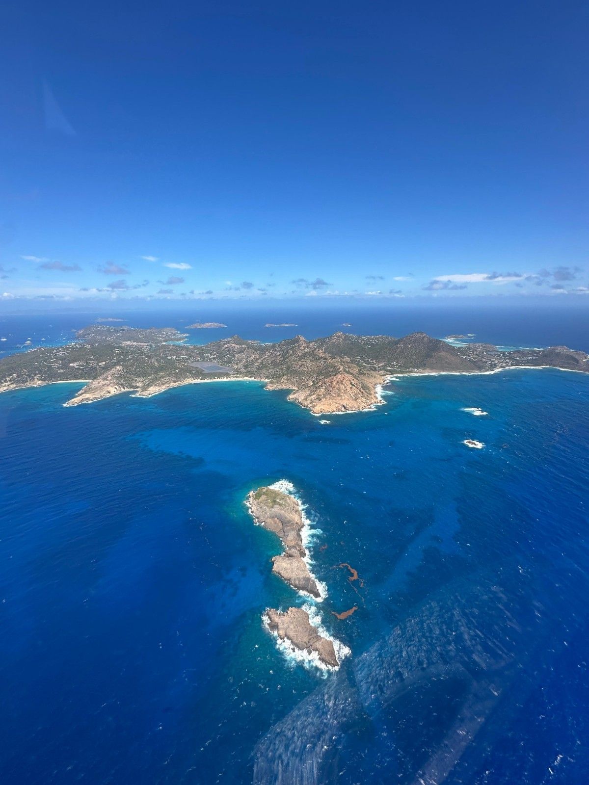 St Barths helicopter view with blue water around