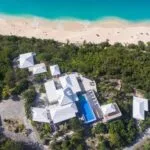 Le Caprice Villa from above surrounded with nature and the sea en beach 