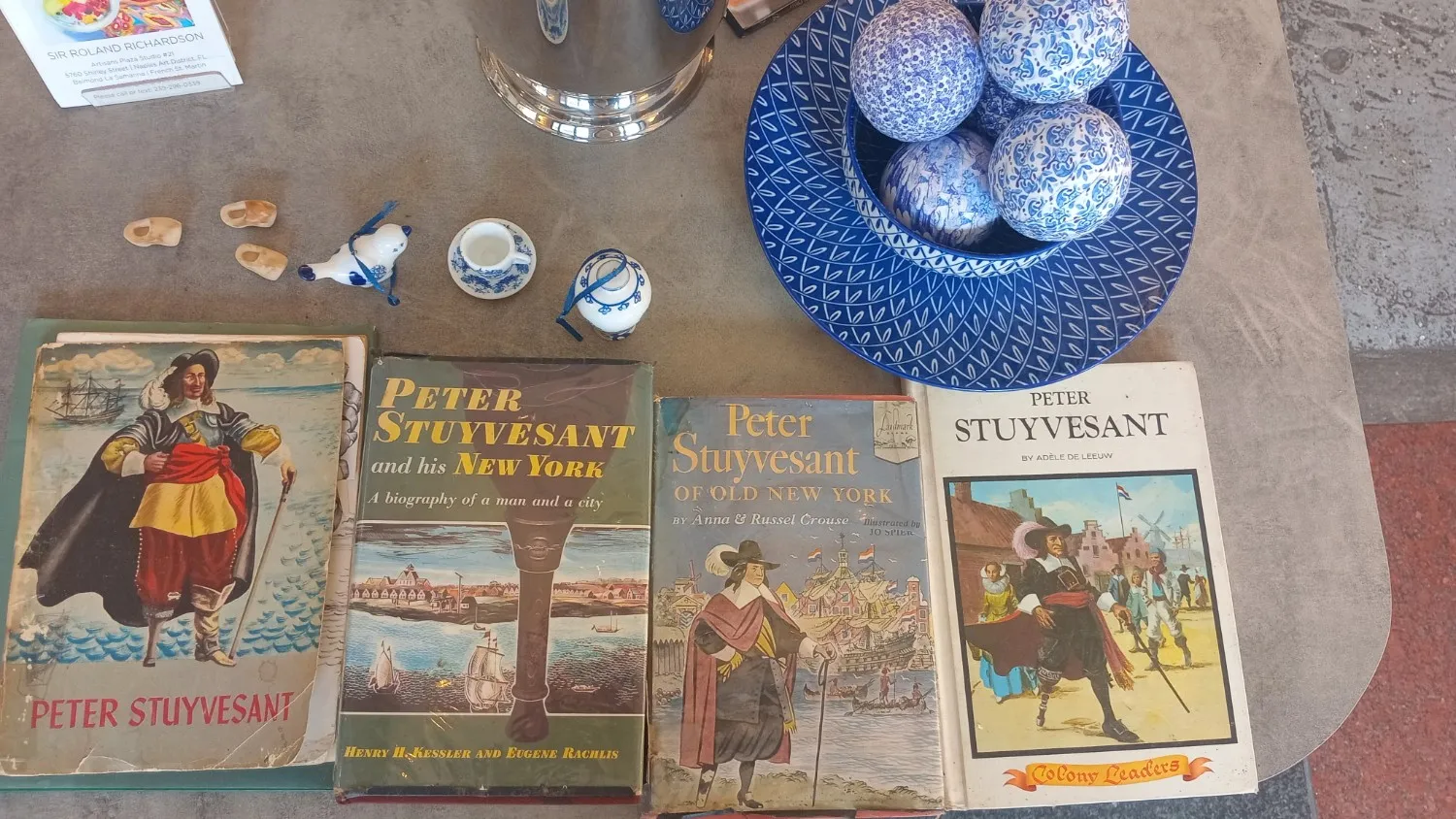 Collection of Delft Blue souvenirs and Stuyvesant books