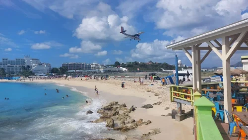 small plane above maho beach