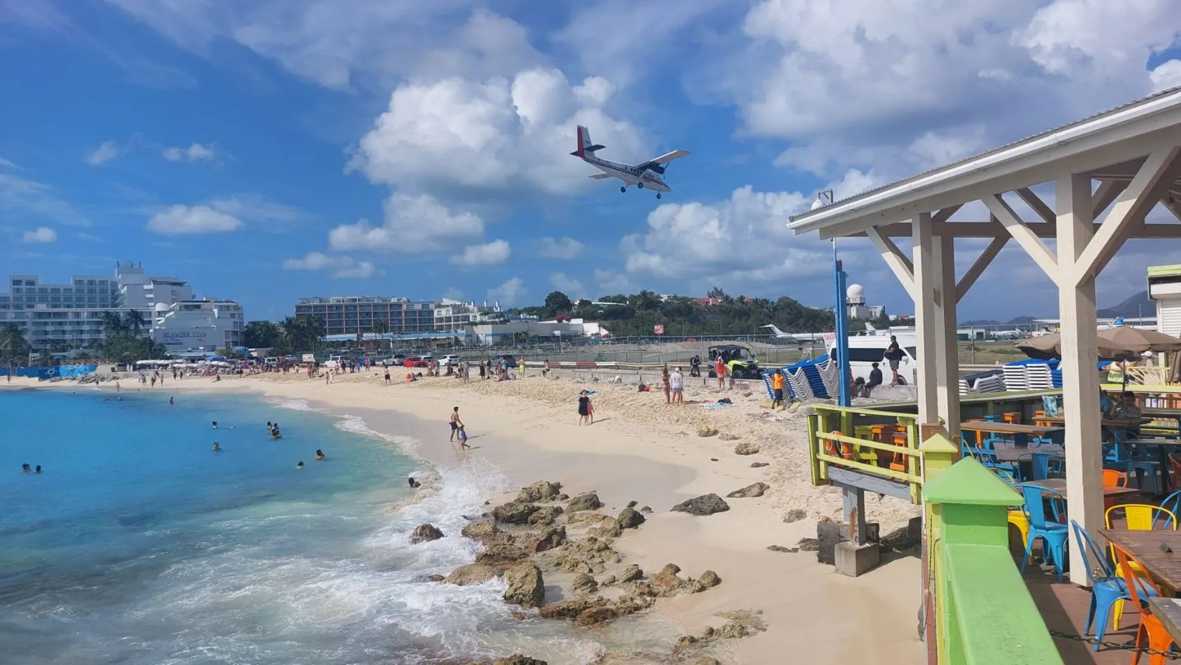 small plane above maho beach