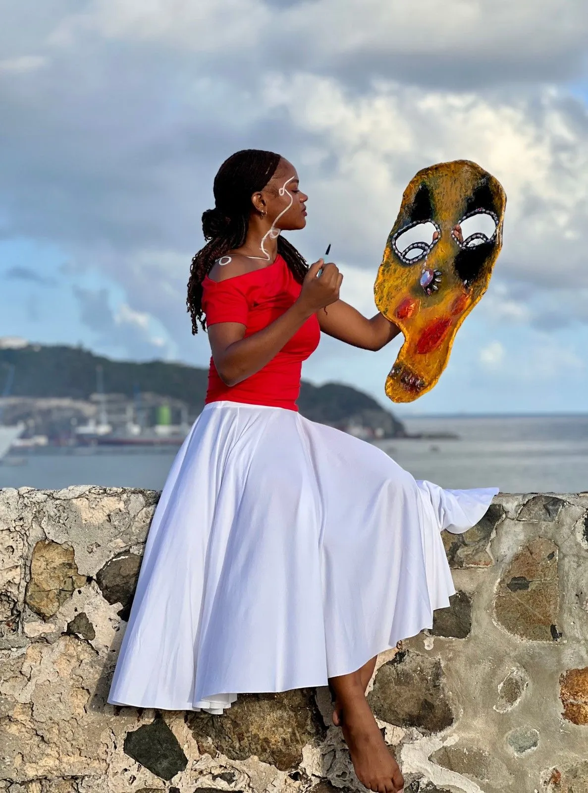 Shannell Bucknor sitting on wall