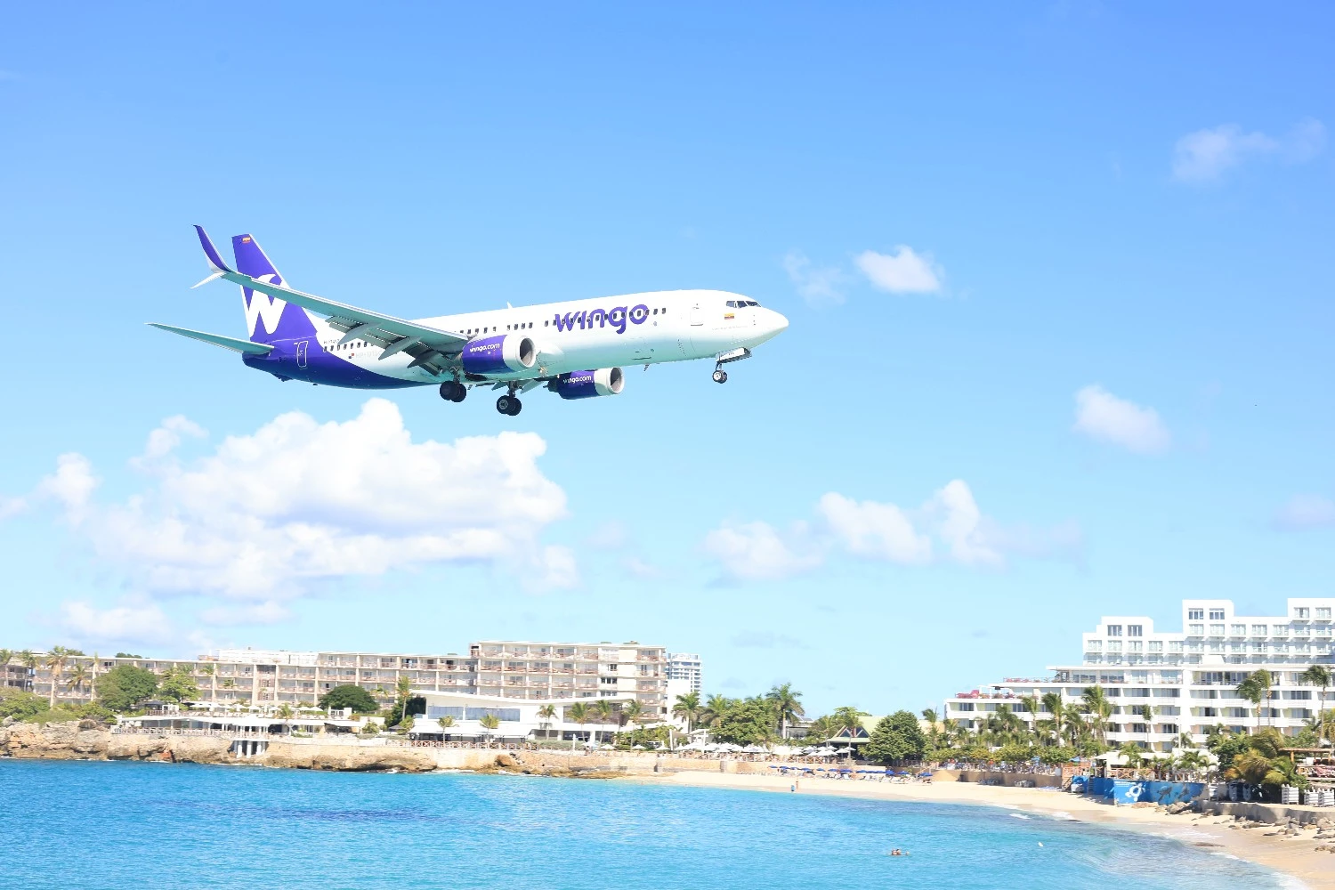 Plane flying over Maho Beach