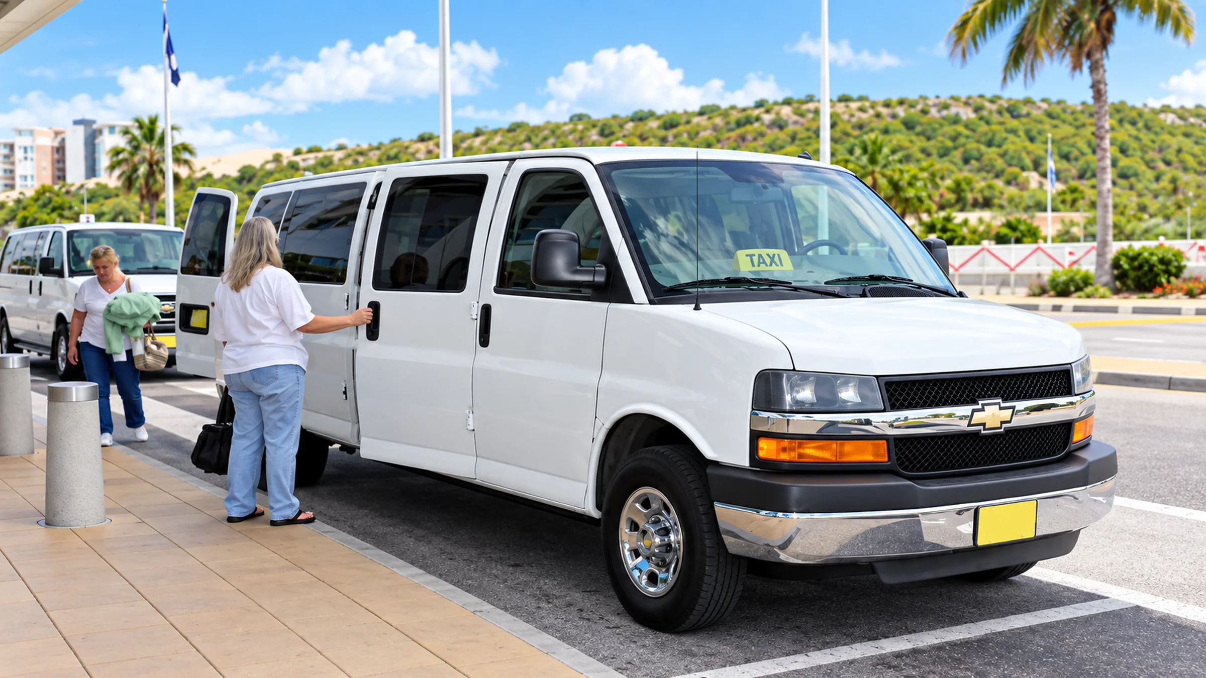 St. Maarten taxi welcomes travelers at an airport pickup area.