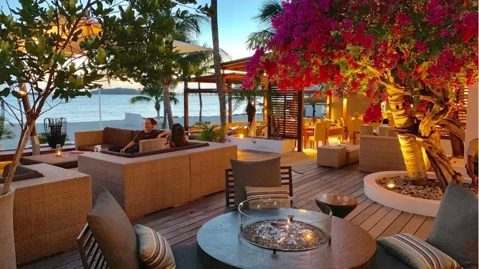 Terrace in the sun with bougainvilleas and view of boardwalk Philipsburg and Fort Amsterdam, St Maarten