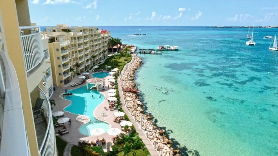 Beach side view of Simpson Bay, marina, Simpson Bay Lagoon, catamarans and the resorts seaview rooms